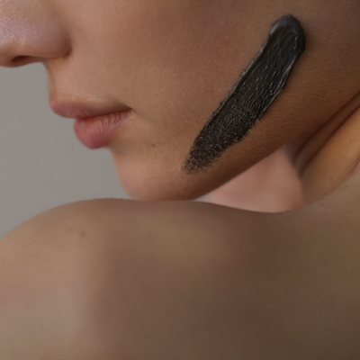 Cheek with silver clay mask applied in a line