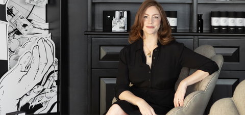Joy Isaacs, Argentum founder and CEO, sat on a chair in the Argentum Notting Hill boutique