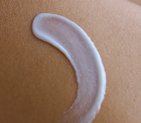 Close up of silver face cream on skin