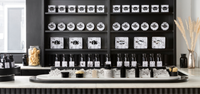 Apothecary style shelves with Argentum skincare and fragrance products in the Notting Hill boutique